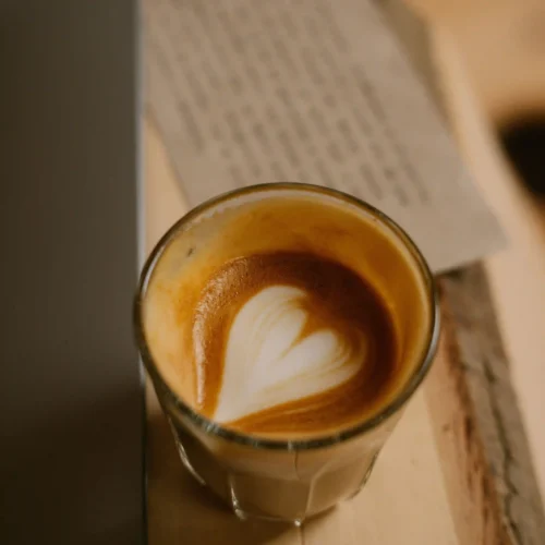 A cup of cortado coffee on a table