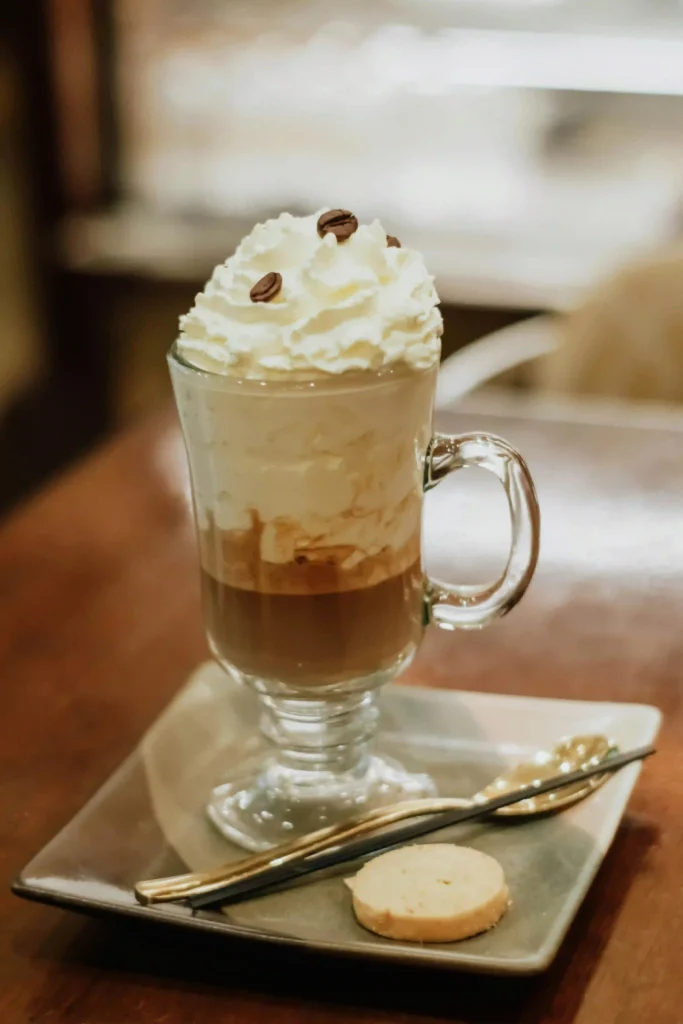 A glass iced white chocolate mocha is made with espresso, chocolate, and cold milk.
