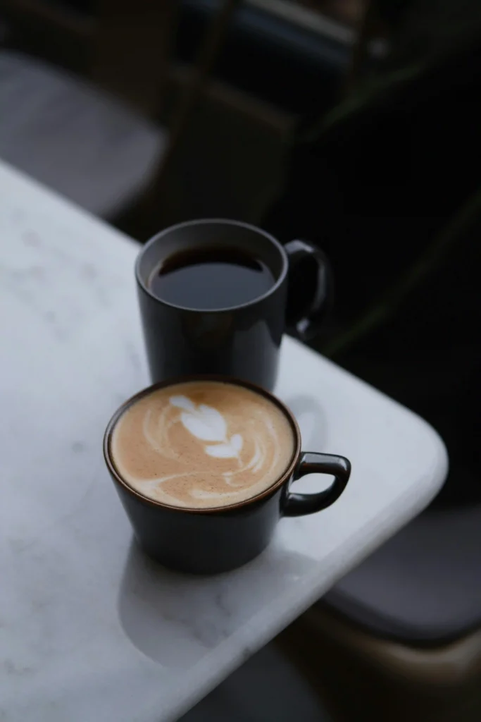 two caffeinated coffee cups